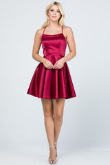 Satin like fit and flare dress with back crisscross spaghetti