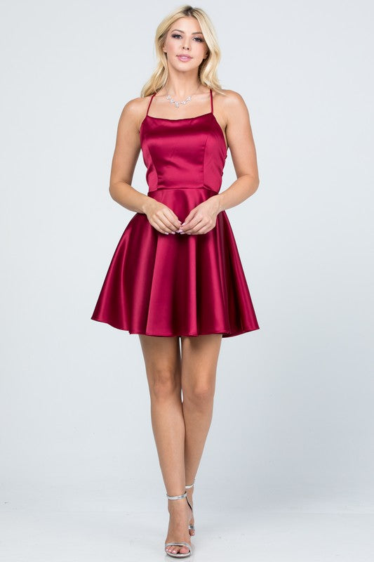 Satin like fit and flare dress with back crisscross spaghetti