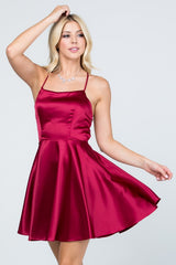 Satin like fit and flare dress with back crisscross spaghetti
