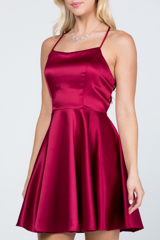Satin like fit and flare dress with back crisscross spaghetti