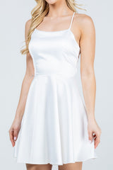 Satin like fit and flare dress with back crisscross spaghetti
