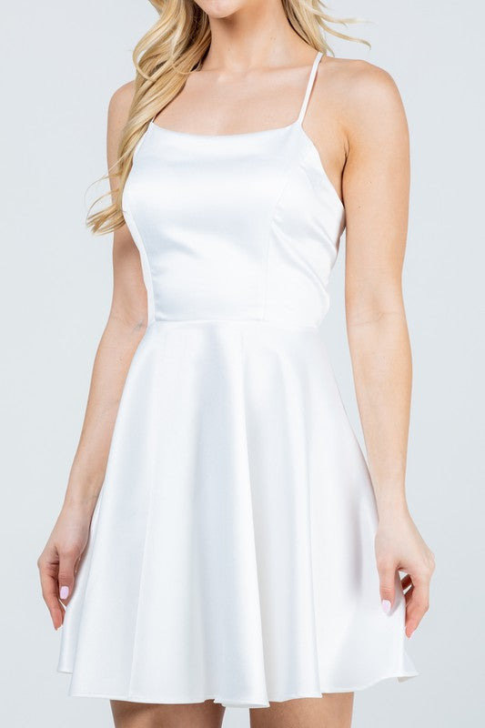 Satin like fit and flare dress with back crisscross spaghetti