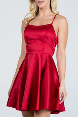 Satin like fit and flare dress with back crisscross spaghetti